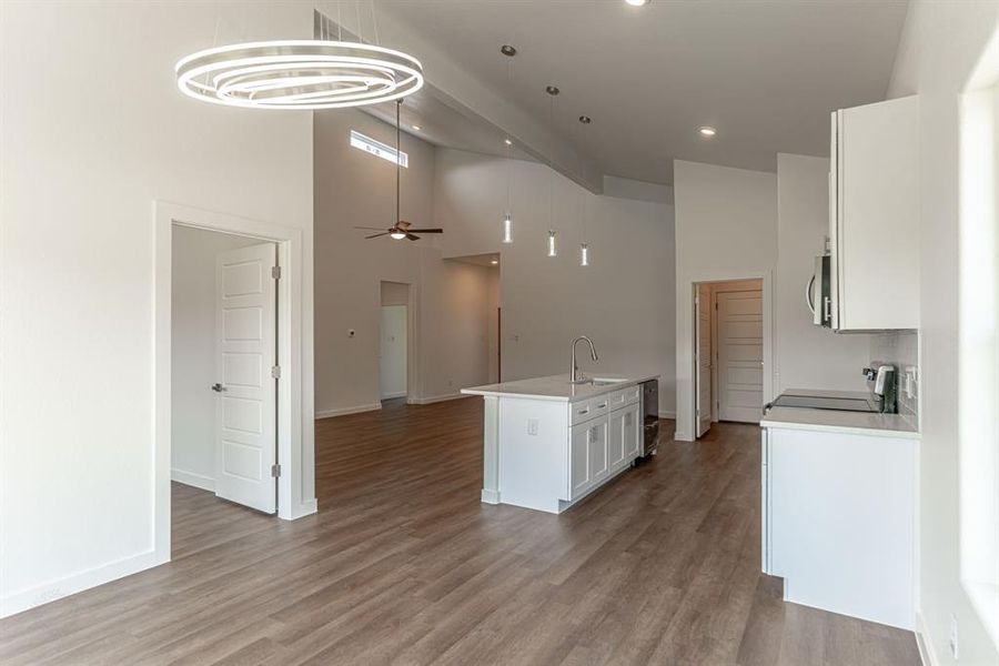 View from dining area into spacious living area and kitchen