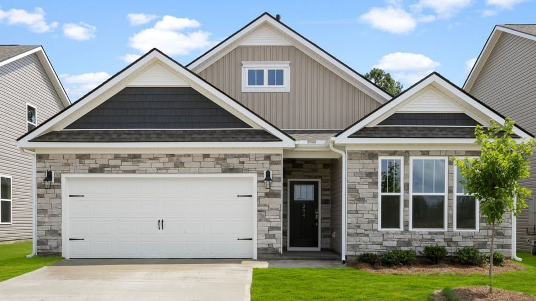 Front exterior of a new home in Seven Oaks, Greenwood, SC, highlighting curb appeal (Image 1). Front exterior of a new home in Seven Oaks, Greenwood, SC, highlighting curb appeal (Image 1).