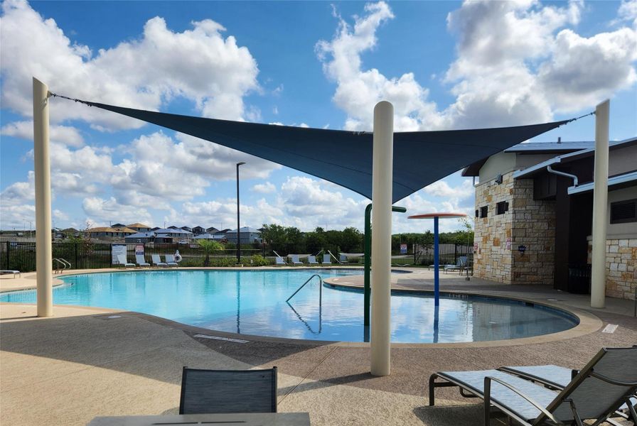 Community pool with a patio area