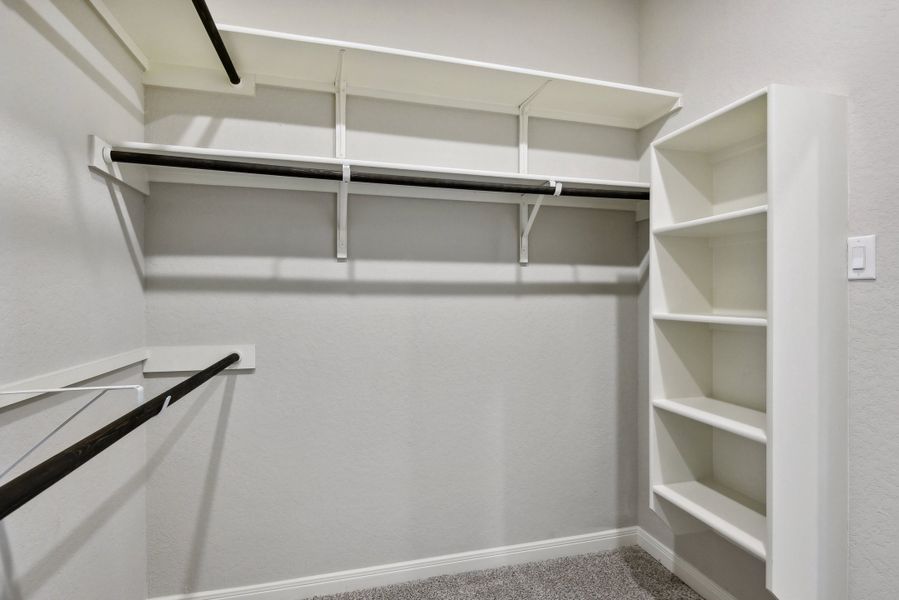 Primary suite walk-in closet in the Medina floorplan at a Meritage Homes community.