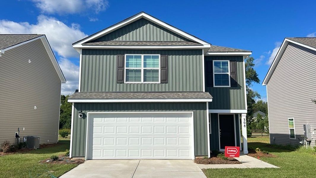 Front exterior of a new home in Hunter's Branch, Hopkins, SC, highlighting curb appeal (Image 1).