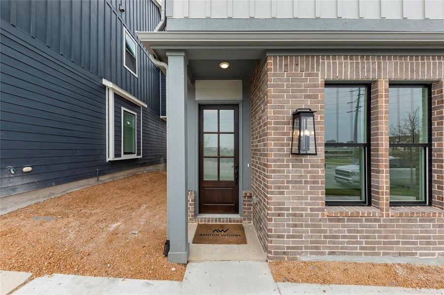 Front exterior of a new home in Collin Creek, Plano, TX, highlighting curb appeal (Image 19).