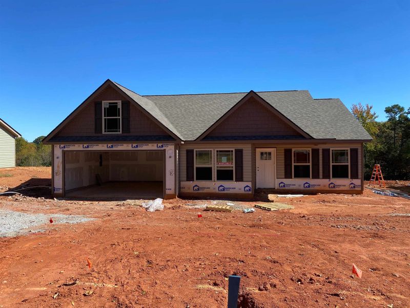 Front exterior of a new home in Huckleberry Cove, Chesnee, SC, highlighting curb appeal (Image 1).