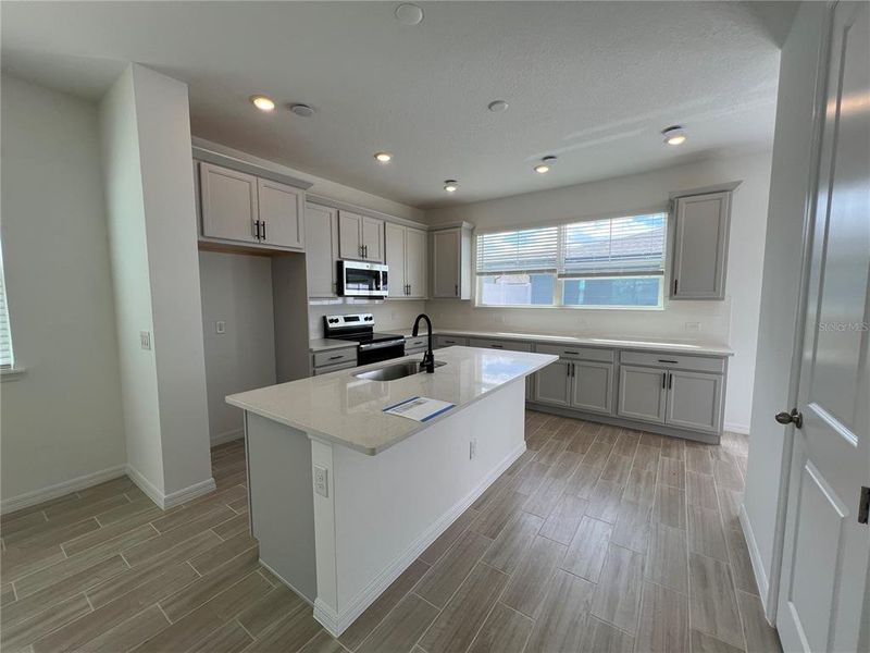 Furnished interior view inside a new home in Northlake Townhomes, Winter Garden (Image 4). Furnished interior view inside a new home in Northlake Townhomes, Winter Garden (Image 4).