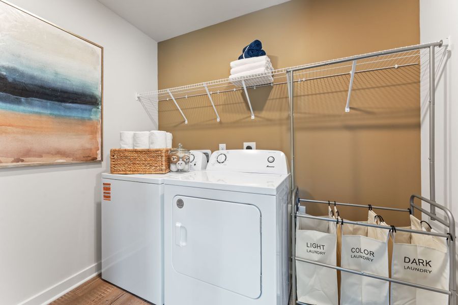 A laundry room with a washer and dryer. A laundry room with a washer and dryer.