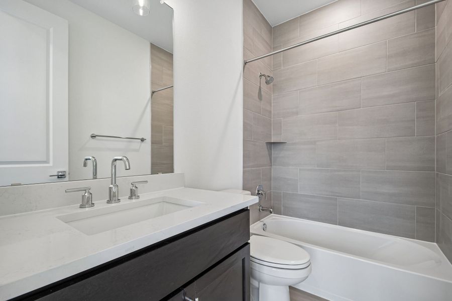 Furnished interior view inside a new home in Freedom at Anthem, Kyle (Image 9).