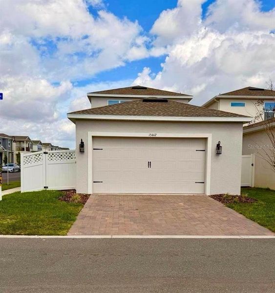 Front exterior of a new home in , Winter Garden, FL, highlighting curb appeal (Image 26).