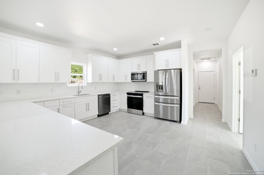 Furnished interior view inside a new home in , Lakehills (Image 11).