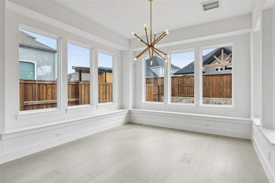 Windows everywhere flood this over the top dining room with natural light.