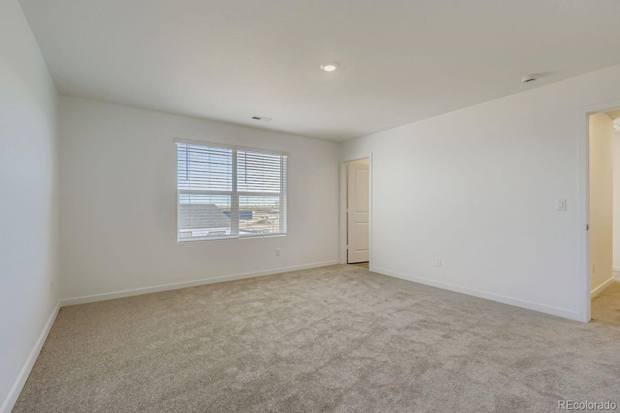 Spacious, unfurnished interior of a new home in Eastcreek Farm: The Camden Collection, Thornton (Image 9).