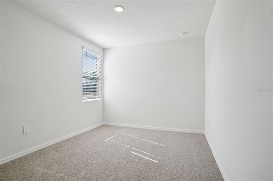 Spacious, unfurnished interior of a new home in Ridgehaven - Villas, Ormond Beach (Image 35).