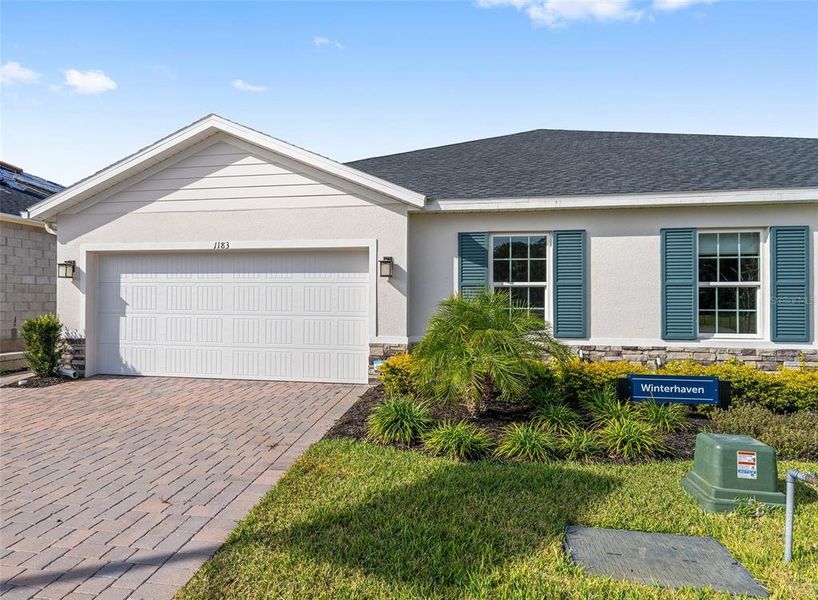 Front exterior of a new home in , Lady Lake, FL, highlighting curb appeal (Image 1). Front exterior of a new home in , Lady Lake, FL, highlighting curb appeal (Image 1).