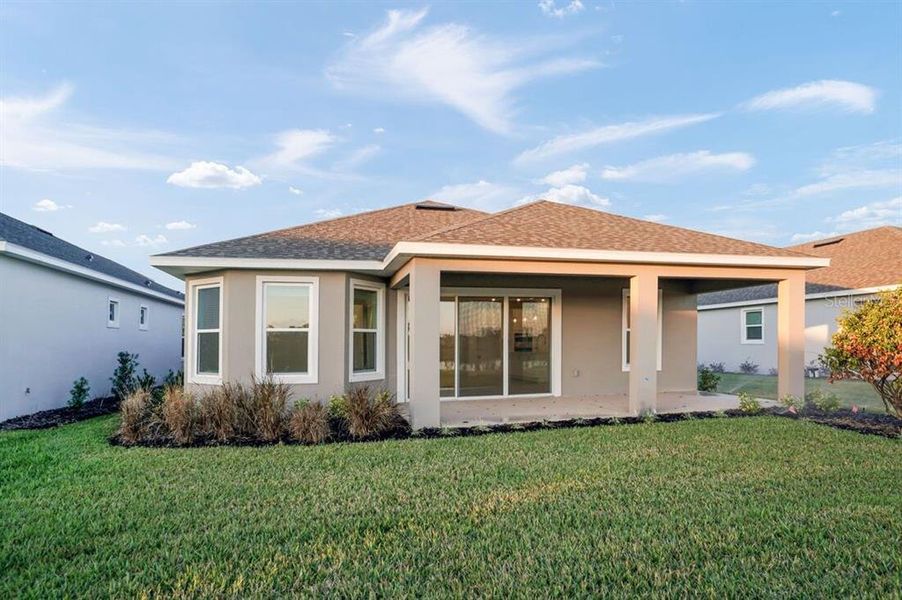 Exterior details and patio area of a home in Esplanade at Center Lake Ranch, St. Cloud (Image 3).