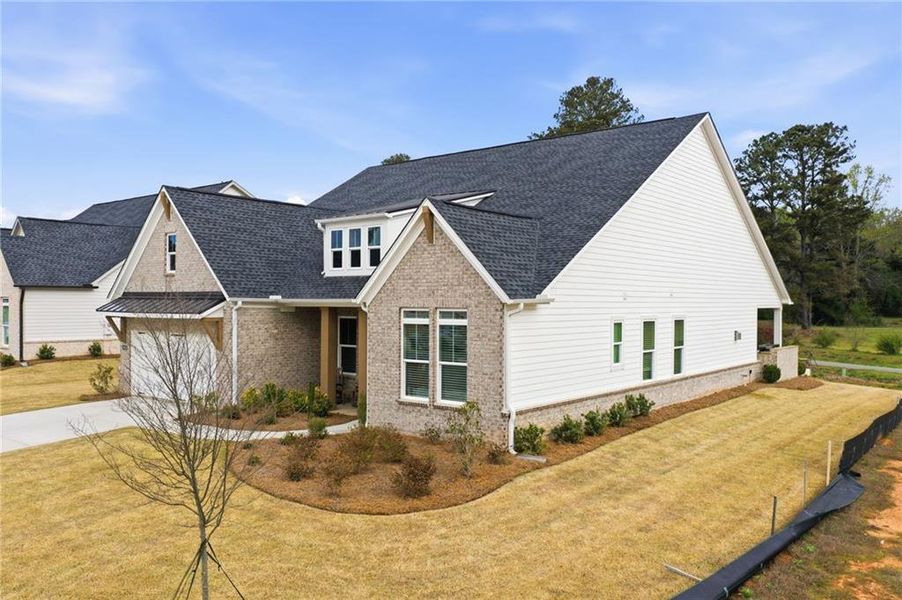 Front exterior of a new home in , Cumming, GA, highlighting curb appeal (Image 2). Front exterior of a new home in , Cumming, GA, highlighting curb appeal (Image 2).