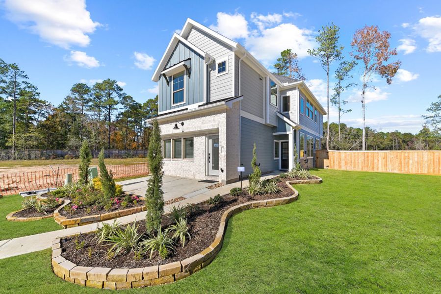 Front exterior of a new home in Meridiana, Manvel, TX, highlighting curb appeal (Image 23).