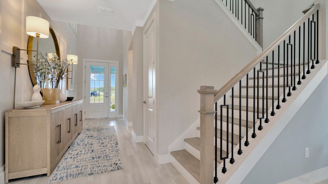 Representative furnished interior of a home built from the Bromeliad by DRB Homes in Primrose at Longleaf, New Port Richey (Image 11).
