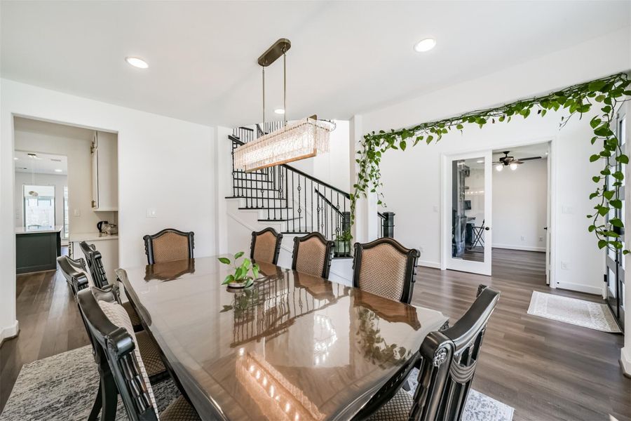 The formal dining room is conveniently located just off the foyer, seamlessly connecting to the elegant winding staircase and providing easy access to the kitchen. The formal dining room is conveniently located just off the foyer, seamlessly connecting to the elegant winding staircase and providing easy access to the kitchen.