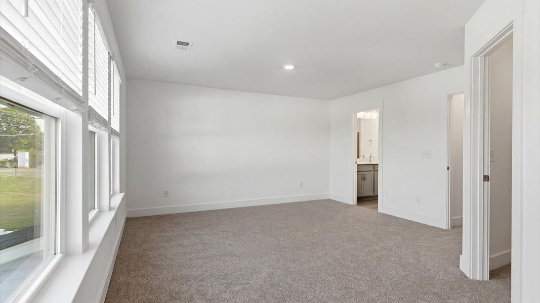 First-rate carpeted flooring and thoughtful upgrades in this select villa by DRB Homes