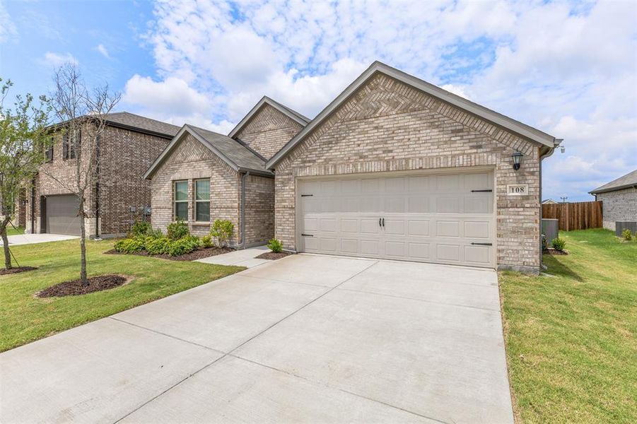 Front exterior of a new home in Verandah, Royse City, TX, highlighting curb appeal (Image 18).