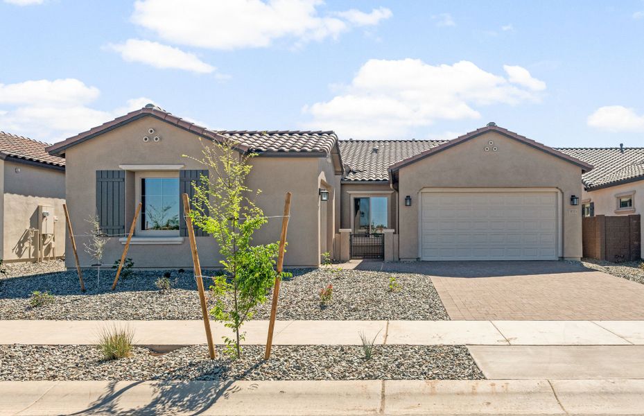Front exterior of a new home in Legado West, Gilbert, AZ, highlighting curb appeal (Image 2). Front exterior of a new home in Legado West, Gilbert, AZ, highlighting curb appeal (Image 2).