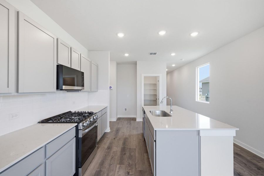 Furnished interior view inside a new home in Stallion Run, Buda (Image 10).