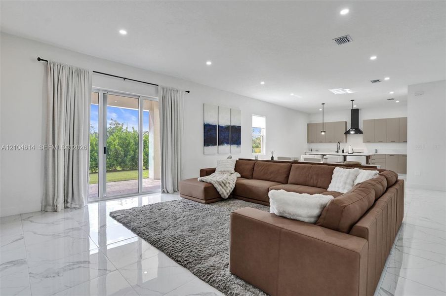 Sliding glass doors provide access to the exterior