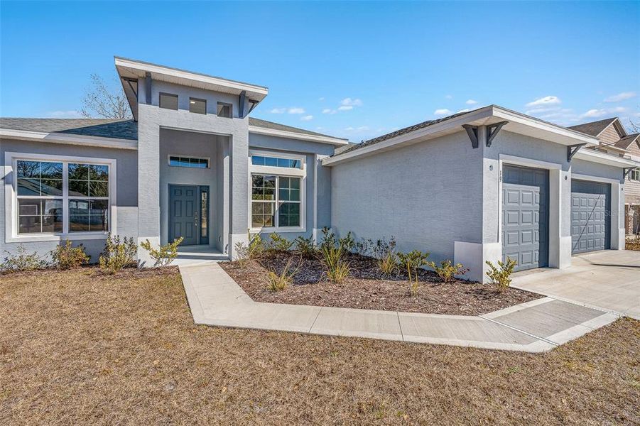 Front exterior of a new home in , Palm Coast, FL, highlighting curb appeal (Image 21). Front exterior of a new home in , Palm Coast, FL, highlighting curb appeal (Image 21).