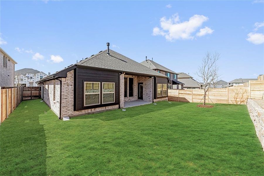 Front exterior of a new home in Painted Tree Woodland District 50, McKinney, TX, highlighting curb appeal (Image 22).