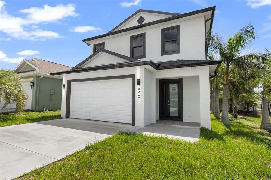 Front exterior of a new home in , Tampa, FL, highlighting curb appeal (Image 20).