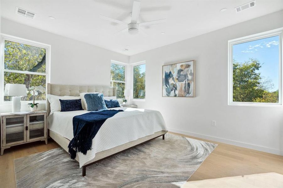 Bedroom with light wood-style flooring and ceiling fan