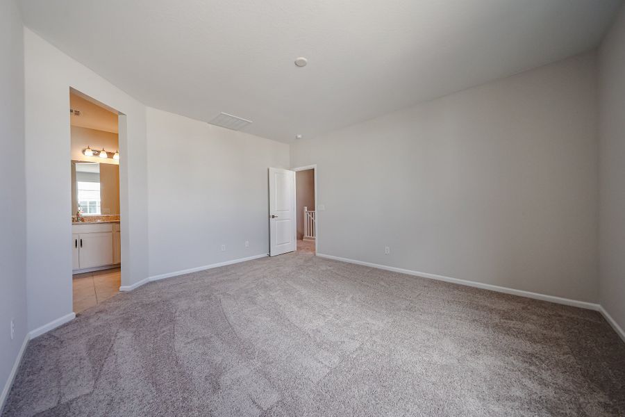A long hallway with white walls.