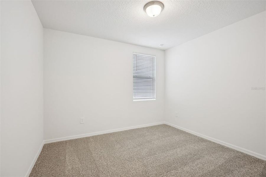 Spacious, unfurnished interior of a new home in Villamar - Signature Series, Winter Haven (Image 17).