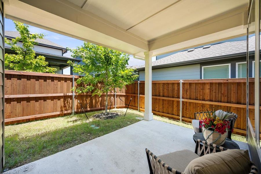 Fenced backyard featuring a patio area Fenced backyard featuring a patio area
