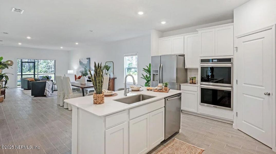 Furnished interior view inside a new home in Edenbrooke at Hyland Trail | 55+: Edenbrooke at Hyland Trail 50s, Green Cove Springs (Image 14).
