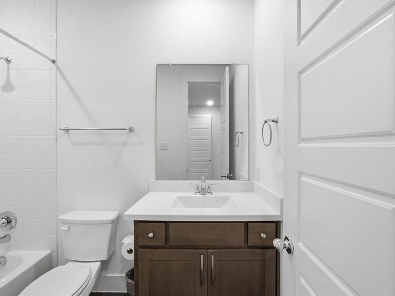 Bathroom with vanity and  shower combination