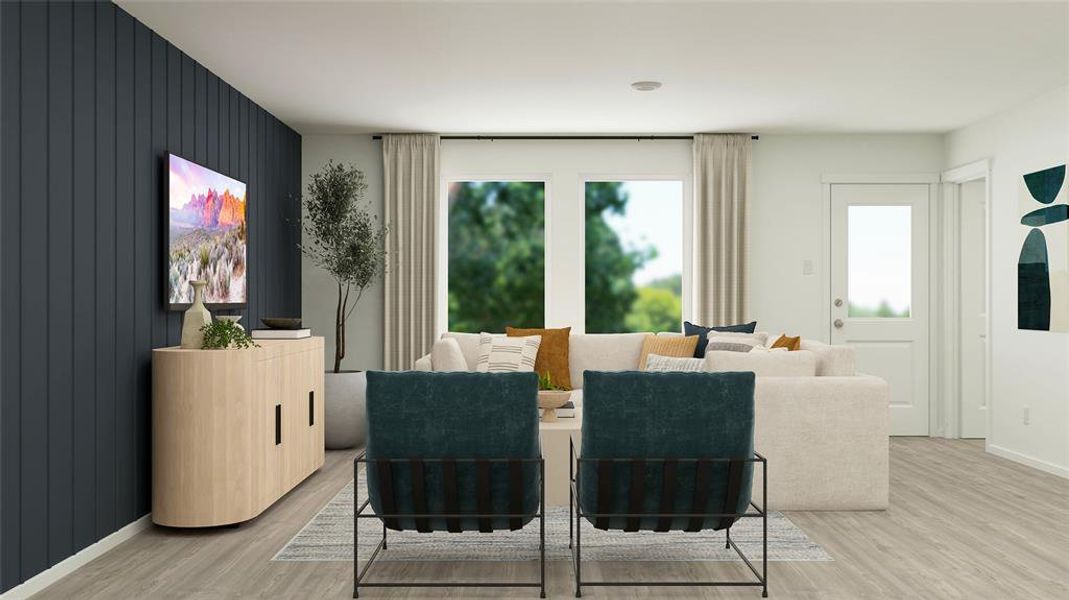 Dining space with light wood-style floors and wooden walls