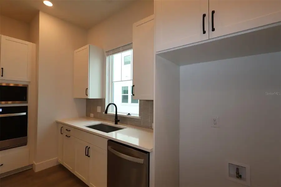 Furnished interior view inside a new home in Apex at Seminole Heights, Tampa (Image 4).