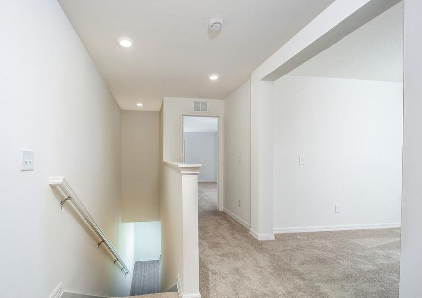 An upstairs flex room provides the perfect space for a home office