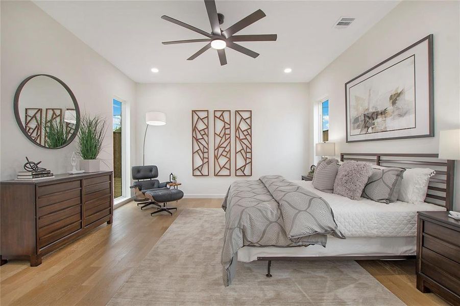 Bedroom featuring light hardwood / wood-style flooring and ceiling fan