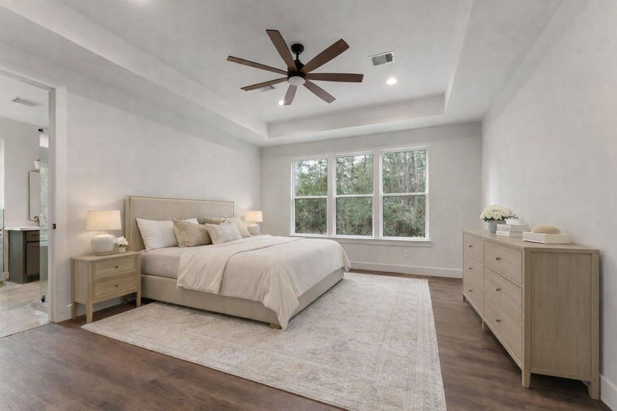Experience this digitally staged, serene bedroom, bathed in natural light with elegant decor and a spacious layout, offering a tranquil retreat in your new home.