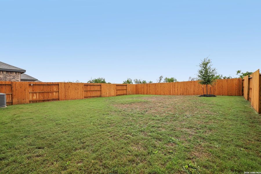 Exterior details and patio area of a home in Hightop Ridge, Converse (Image 22).