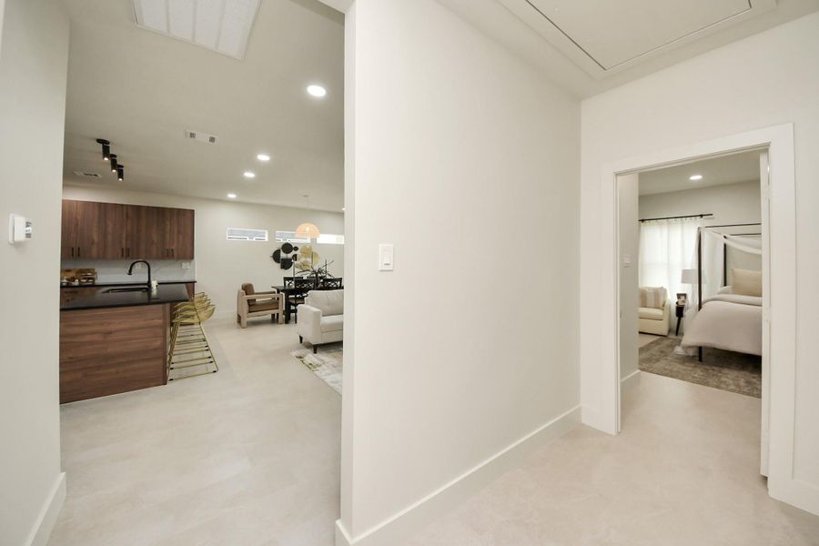 Seamless transition from the inviting living area to the serene primary bedroom.