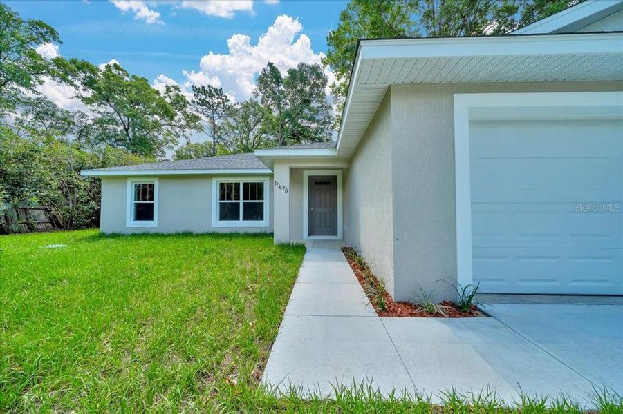 Front exterior of a new home in , Ocala, FL, highlighting curb appeal (Image 2).