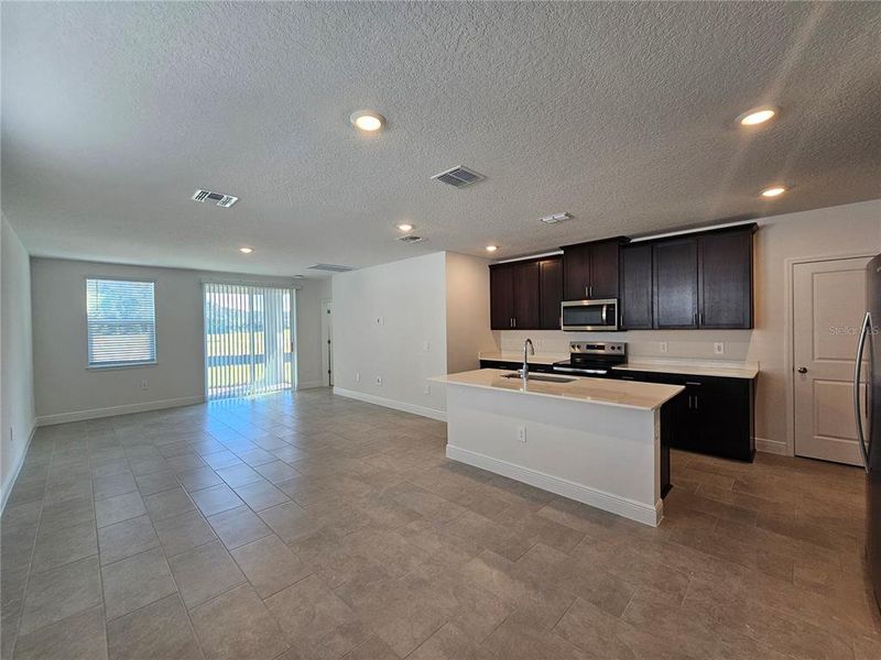 Furnished interior view inside a new home in The Reserve at Hammock Oaks - Classic Series, Lady Lake (Image 10).