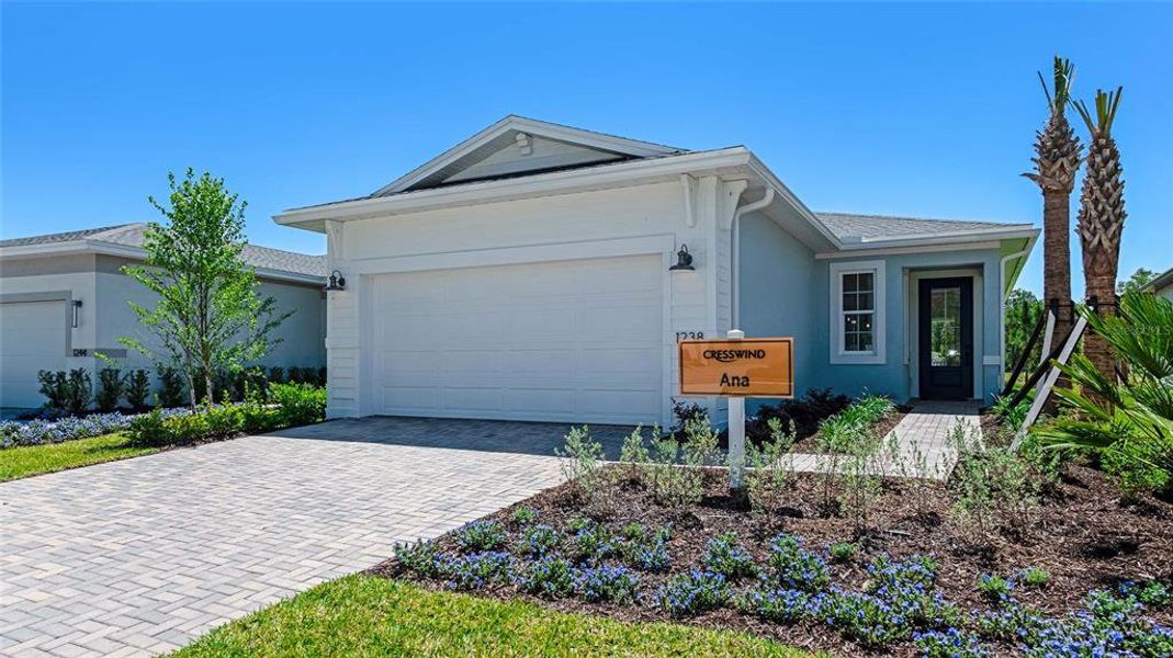 Front exterior of a new home in Cresswind DeLand, Deland, FL, highlighting curb appeal (Image 1). Front exterior of a new home in Cresswind DeLand, Deland, FL, highlighting curb appeal (Image 1).