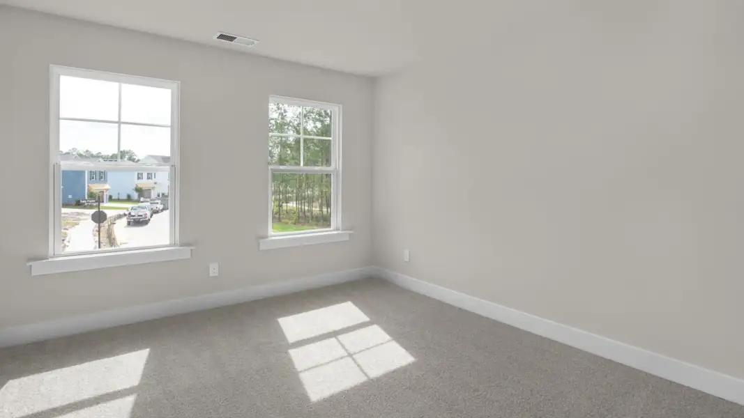 Representative unfurnished interior of a home built from the Forrester by D.R. Horton in The Highlands at Cedar Hill Landing, Navassa (Image 33).