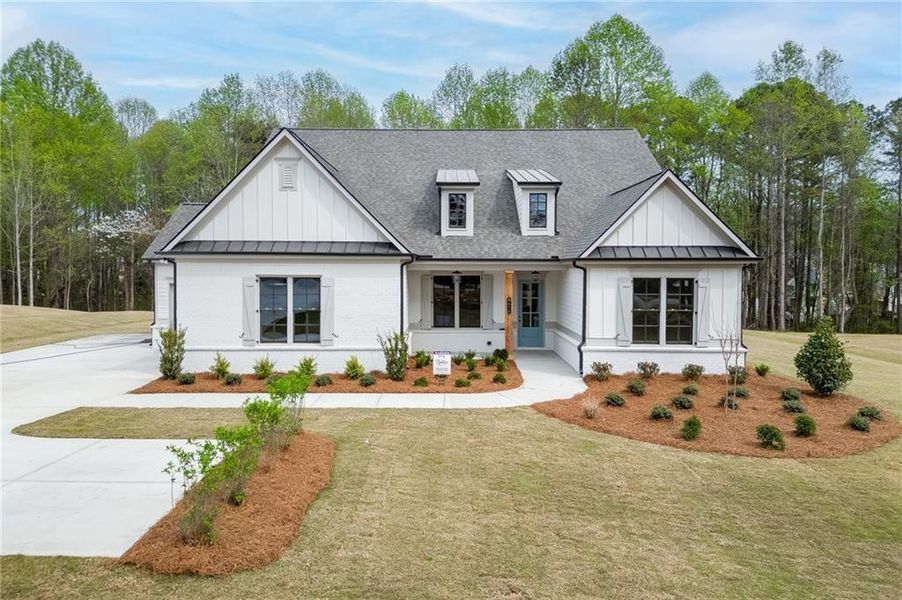 Front exterior of a new home in , Cumming, GA, highlighting curb appeal (Image 27).