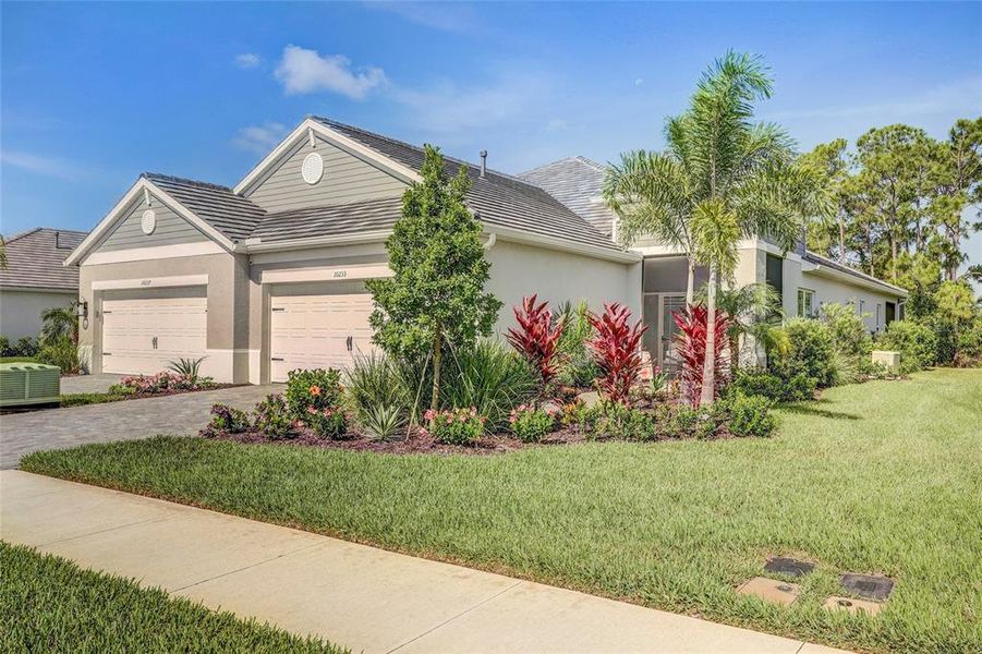 Front exterior of a new home in , Sarasota, FL, highlighting curb appeal (Image 2). Front exterior of a new home in , Sarasota, FL, highlighting curb appeal (Image 2).