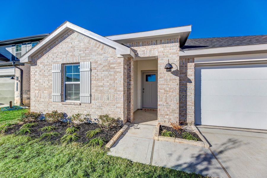 Front exterior of a new home in , Fulshear, TX, highlighting curb appeal (Image 2). Front exterior of a new home in , Fulshear, TX, highlighting curb appeal (Image 2).