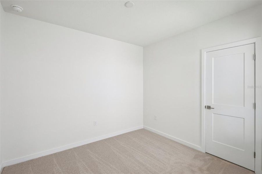 Spacious, unfurnished interior of a new home in Grasslands West, Lakeland (Image 16).